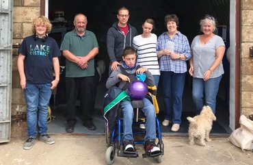 Volunteers and family at the entrance to The Bunker, the base for the Balmedie Beach Wheelchairs
